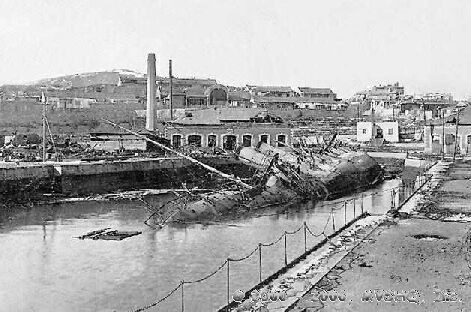 The Russian minelayer Amur sunk at Port Arthur as a result of bombardment by Japanese land based artillery during the siege of P